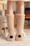 Chaussettes moumoute beige avec ourson en relief au talon, douces et chaudes pour cocooner