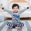 Pyjama T-Rex garçon gris, haut à manches longues à motif T-Rex et pantalon à rayures assorti